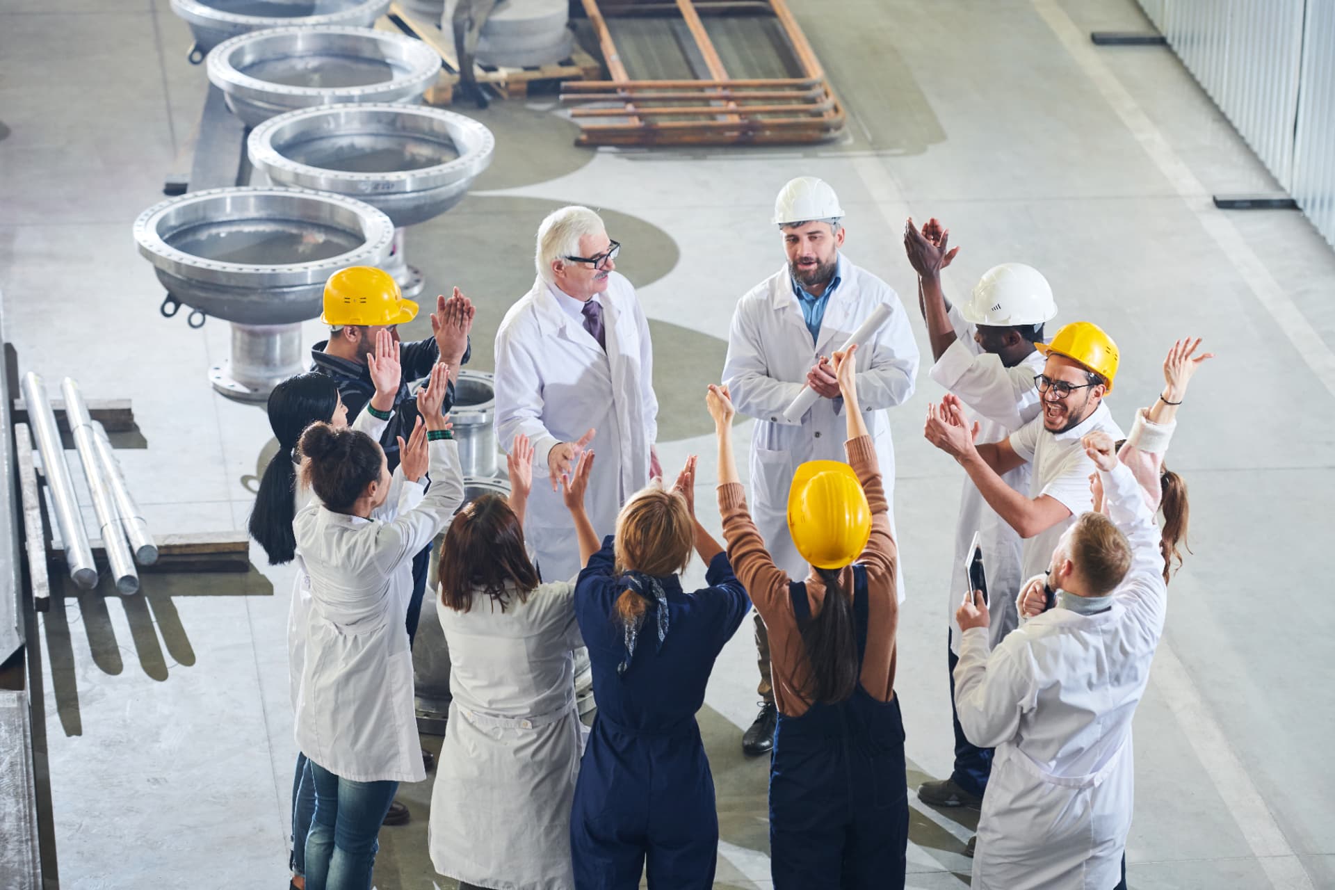 Manufacturing leadership team in a listening interview around a conference table