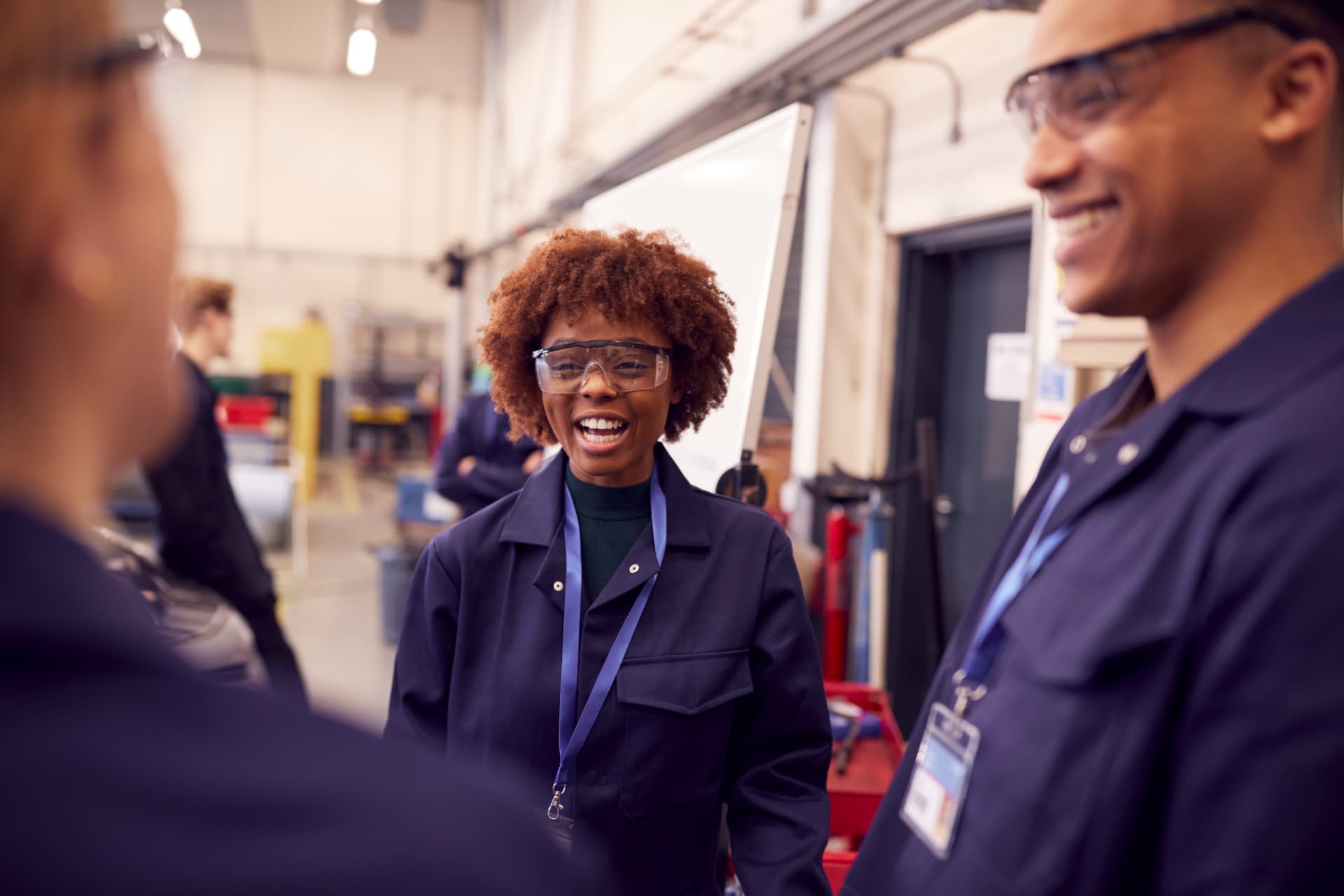 Manufacturing team members talking together on the plant floor